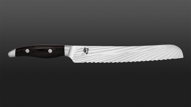 
                    Nagare Black bread knife with riveted handle scales made of black pakka wood, an impregnated and particularly durable wood veneer