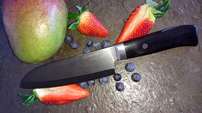 
                    The Kyocera Black Santoku with fruits